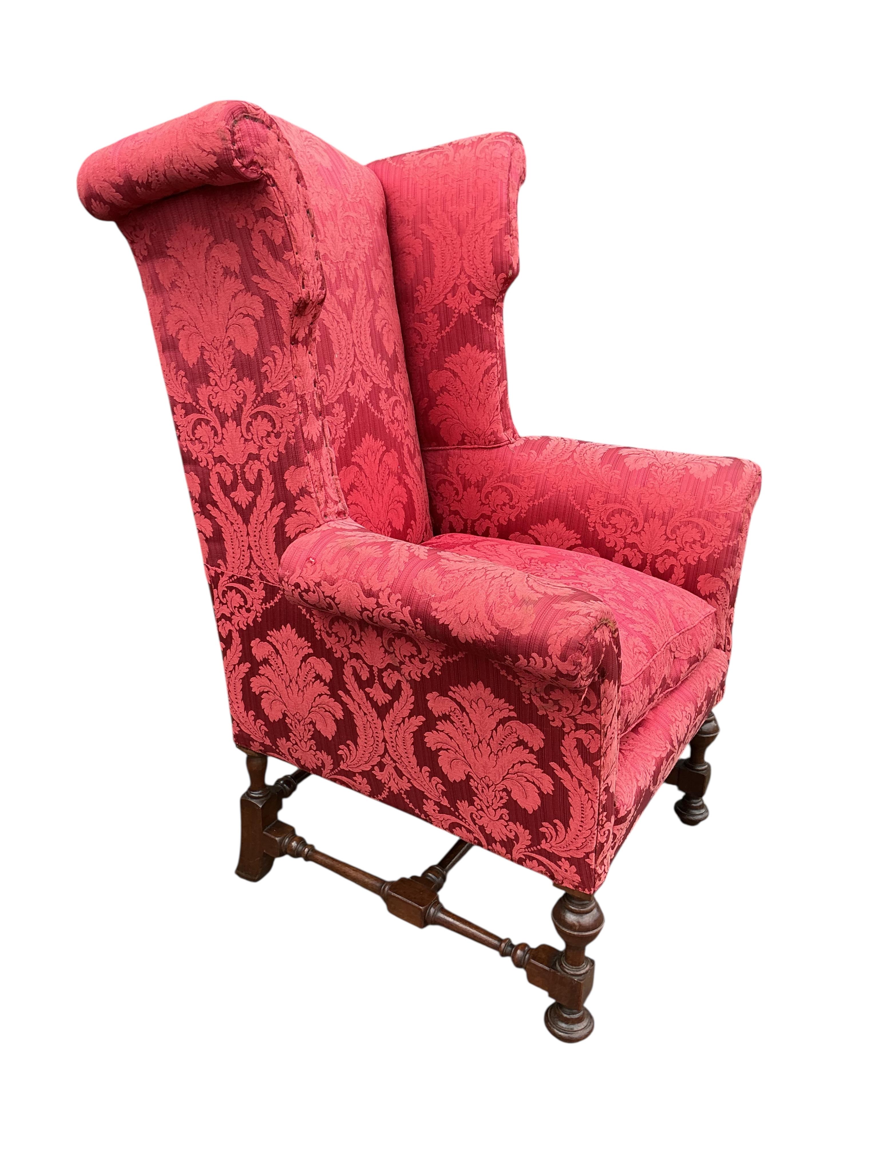 A pair of early 20th century Jacobean Revival upholstered wing armchairs, width 81cm, depth 75cm, height 127cm